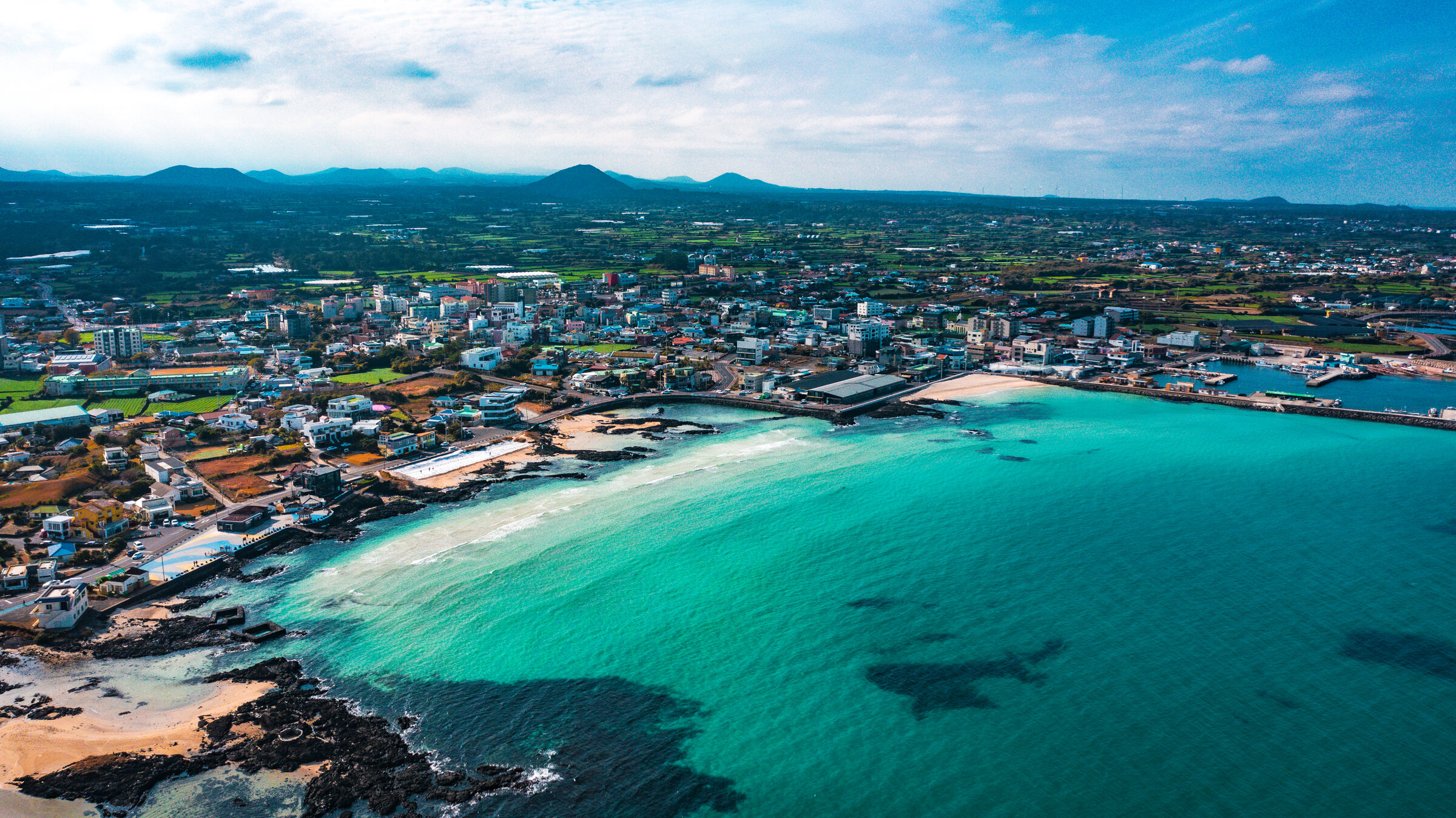 Jeju coast at first light, tuff cone in the distance